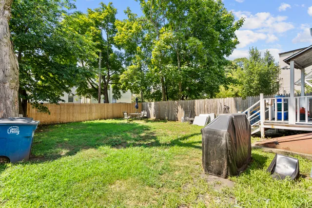 a view of backyard with green space