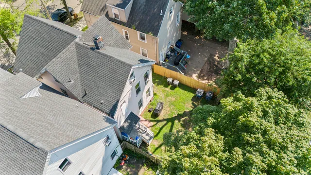 an aerial view of houses with yard