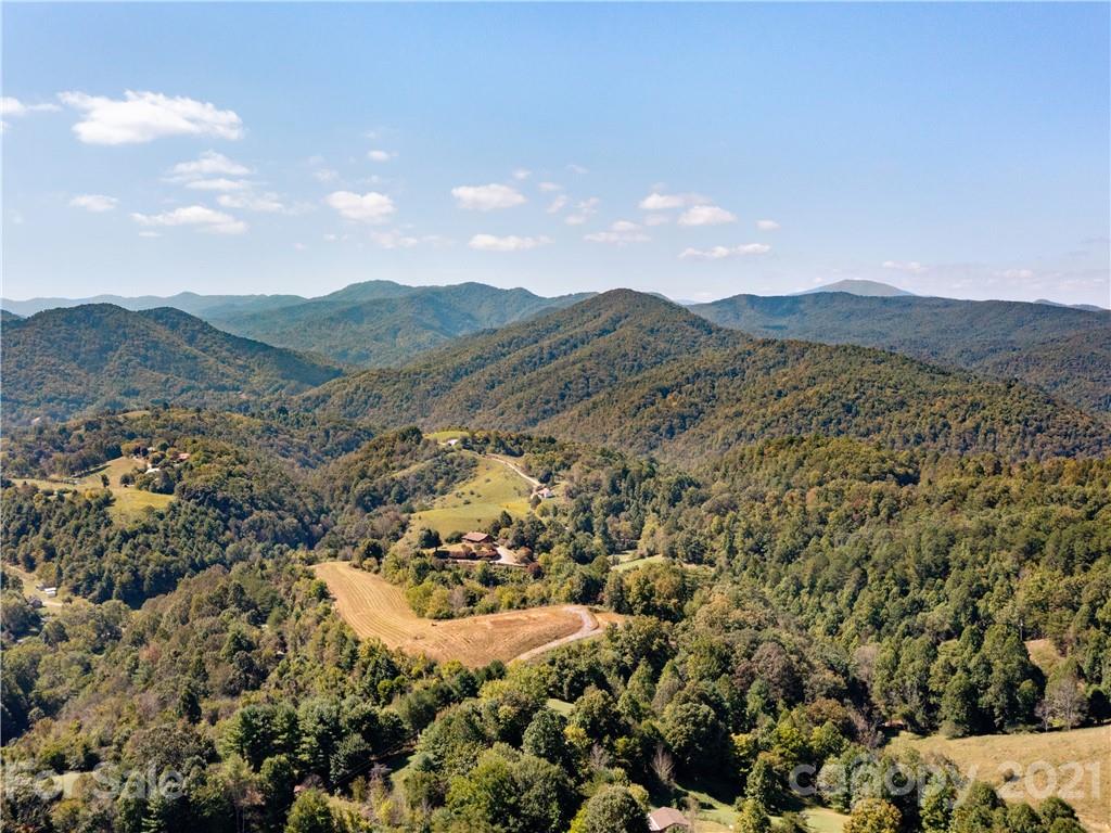 354 Sandy Bottom Road Marshall, NC 28753 - Photo 11 of 12 a view of a city with mountains in the background