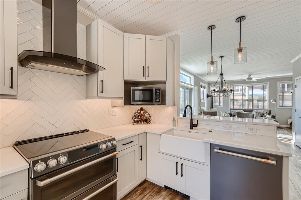 263 Saddle Ridge Drive, Unit 263 Silverthorne, CO 80498 - Photo 1 of 25 a kitchen with stainless steel appliances a sink stove and cabinets