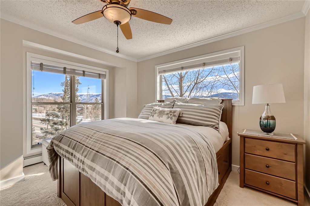 263 Saddle Ridge Drive, Unit 263 Silverthorne, CO 80498 - Photo 13 of 25 a bedroom with a bed and a window