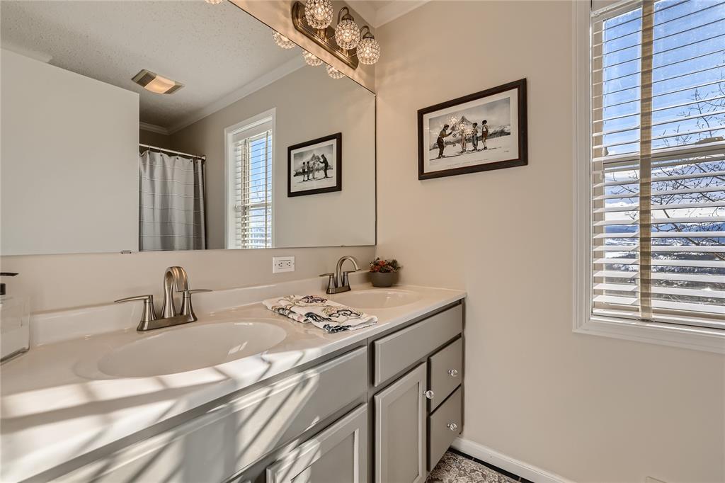 263 Saddle Ridge Drive, Unit 263 Silverthorne, CO 80498 - Photo 18 of 25 a bathroom with a sink and a mirror