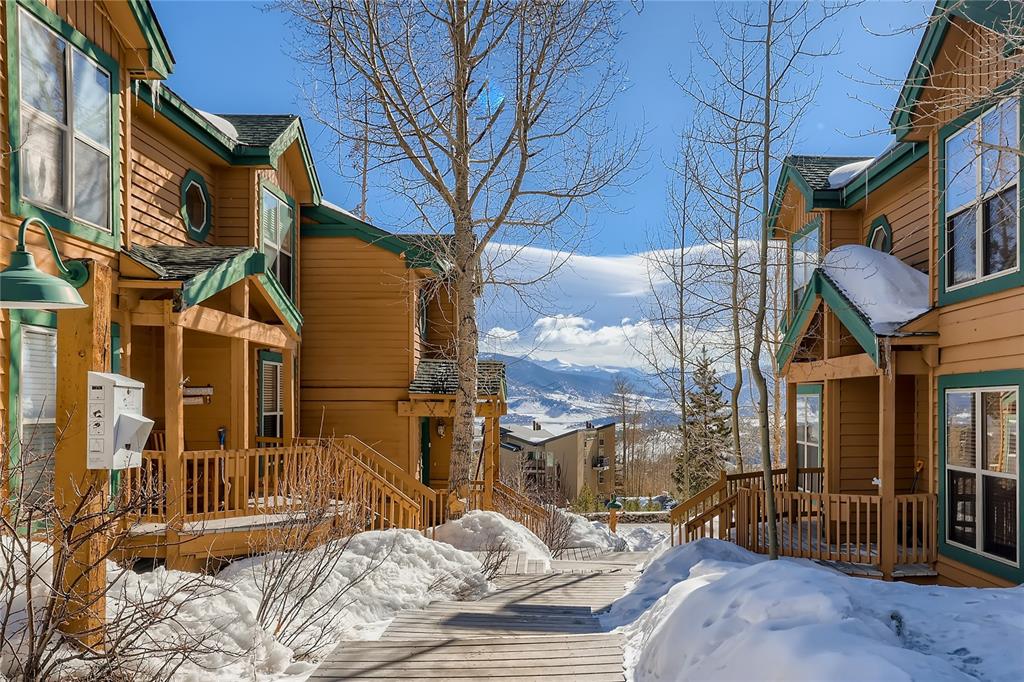 263 Saddle Ridge Drive, Unit 263 Silverthorne, CO 80498 - Photo 25 of 25 a view of a house with a yard covered in snow
