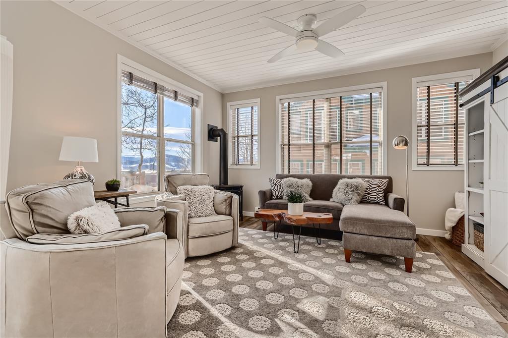 263 Saddle Ridge Drive, Unit 263 Silverthorne, CO 80498 - Photo 7 of 25 a living room with furniture and a large window