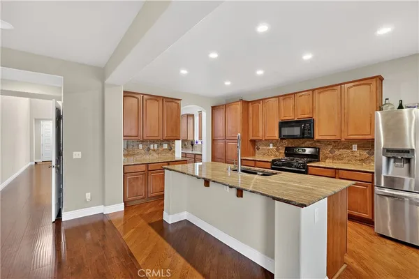 a view of a kitchen area with furniture and staircase