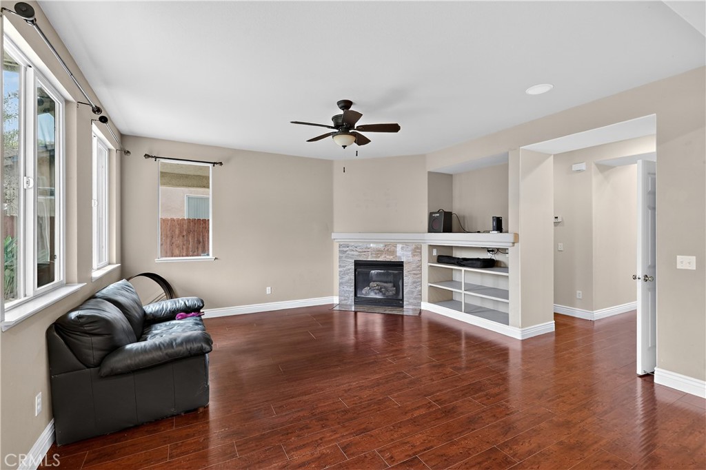 1277 Baxter Drive Merced, CA 95348 - Photo 19 of 63 a living room with furniture and a fireplace