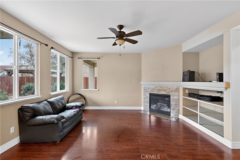 1277 Baxter Drive Merced, CA 95348 - Photo 20 of 63 a living room with furniture and a fireplace