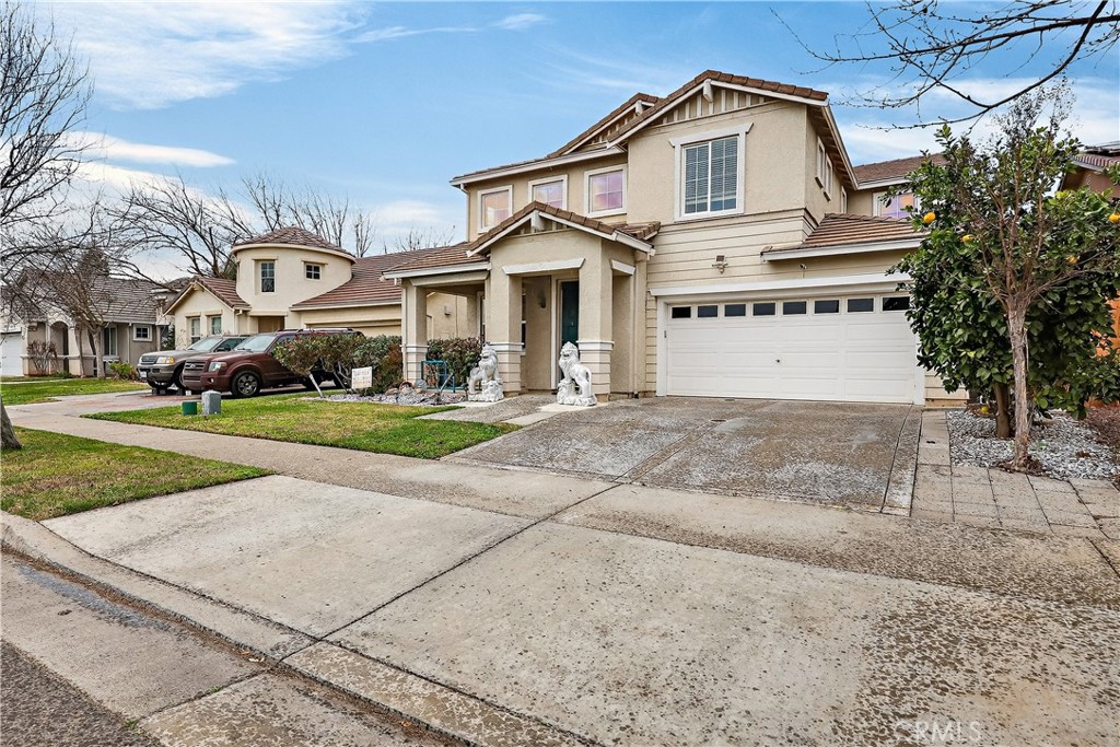 1277 Baxter Drive Merced, CA 95348 - Photo 2 of 63 a view of a white house with a yard and plants