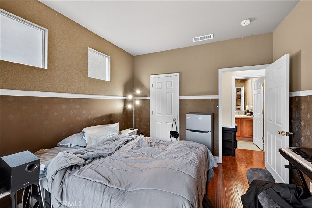 1277 Baxter Drive Merced, CA 95348 - Photo 27 of 63 a bedroom with a bed and a flat screen tv