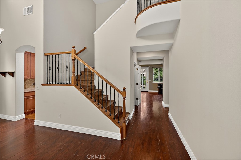 1277 Baxter Drive Merced, CA 95348 - Photo 28 of 63 a view of a hallway with wooden floor and staircase