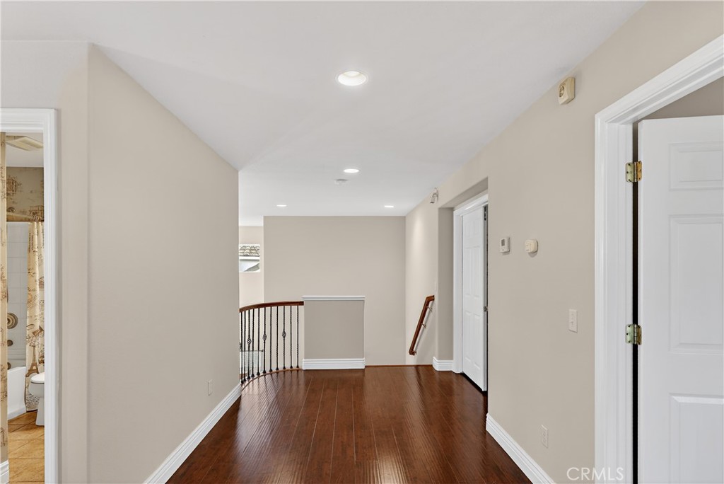 1277 Baxter Drive Merced, CA 95348 - Photo 30 of 63 a view of a hallway with wooden floor and staircase