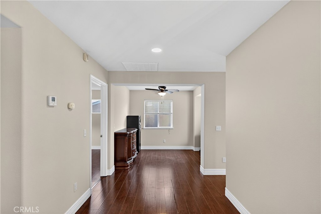 1277 Baxter Drive Merced, CA 95348 - Photo 31 of 63 a view of a hallway with wooden floor and closet