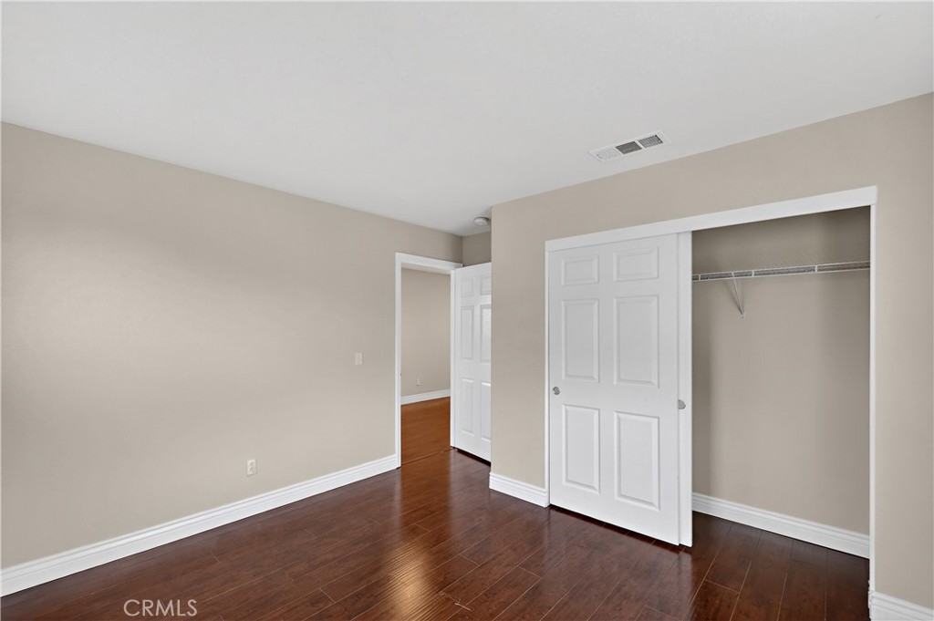 1277 Baxter Drive Merced, CA 95348 - Photo 33 of 63 a view of an empty room with wooden floor