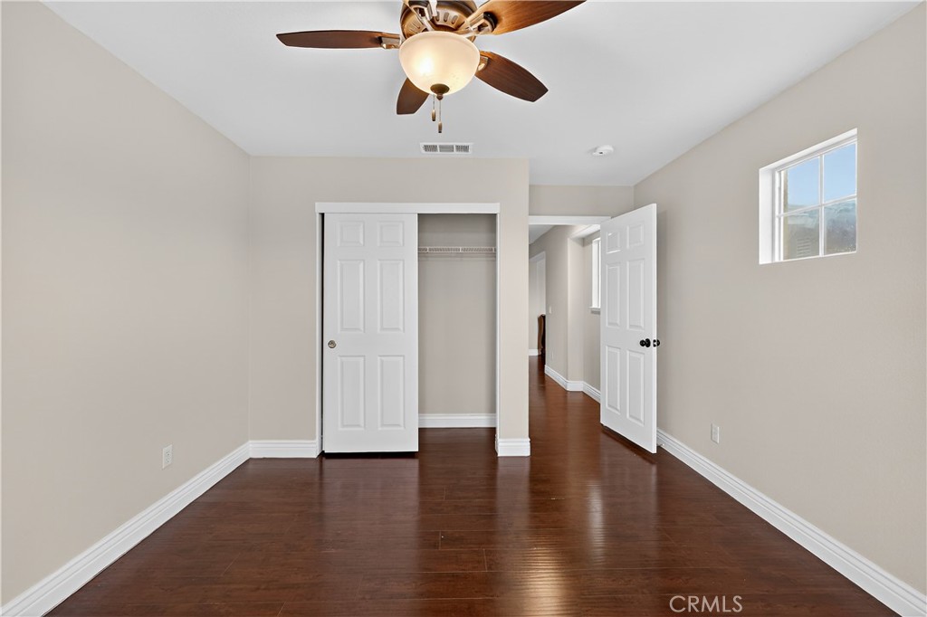 1277 Baxter Drive Merced, CA 95348 - Photo 46 of 63 a view of an empty room with a window and wooden floor