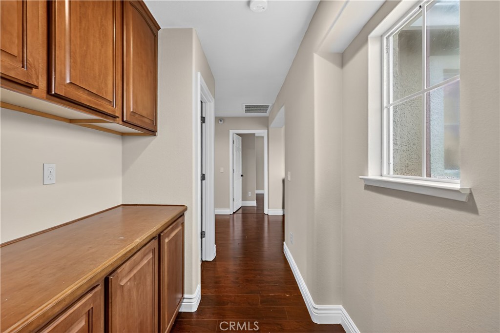 1277 Baxter Drive Merced, CA 95348 - Photo 47 of 63 a view of a hallway with wooden floor and entryway