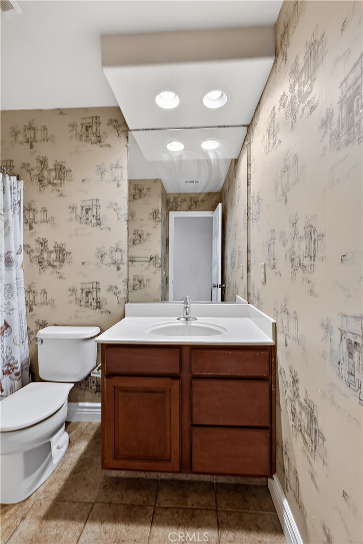 1277 Baxter Drive Merced, CA 95348 - Photo 49 of 63 a bathroom with a sink a toilet and shower