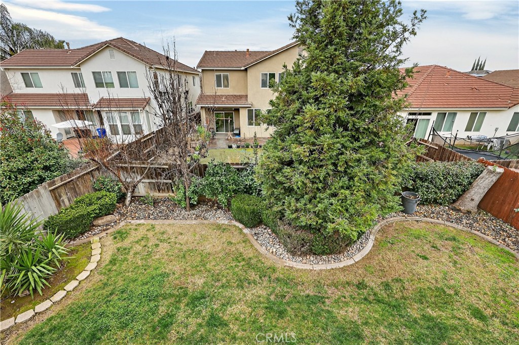 1277 Baxter Drive Merced, CA 95348 - Photo 55 of 63 a view of a house with backyard and sitting area
