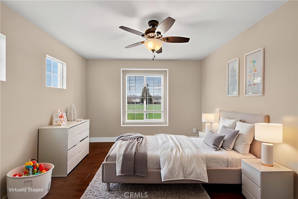 1277 Baxter Drive Merced, CA 95348 - Photo 7 of 63 a bedroom with a bed and a chandelier