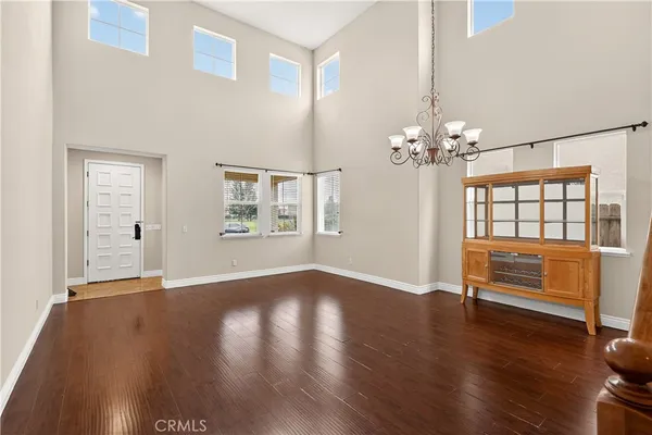 a view of an entryway with wooden floor