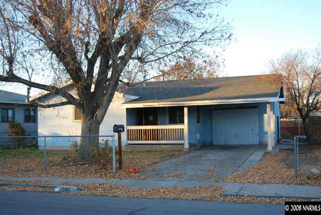 1585 Trainer Way Reno, NV 89512 - Photo 1 of 9 a front view of a house with a yard and garage