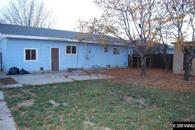 1585 Trainer Way Reno, NV 89512 - Photo 7 of 9 a backyard of a house with lots of green space