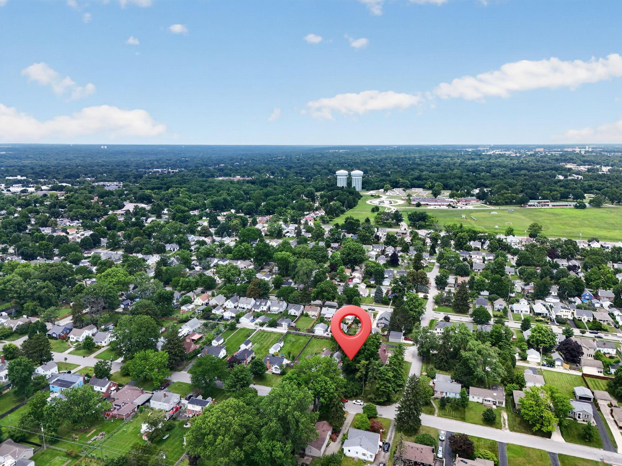 492 Wetmore Road Columbus, OH 43214 - Photo 49 of 55 Aerial perspective showcasing a residential neighborhood with mature trees and a range of single-story homes
