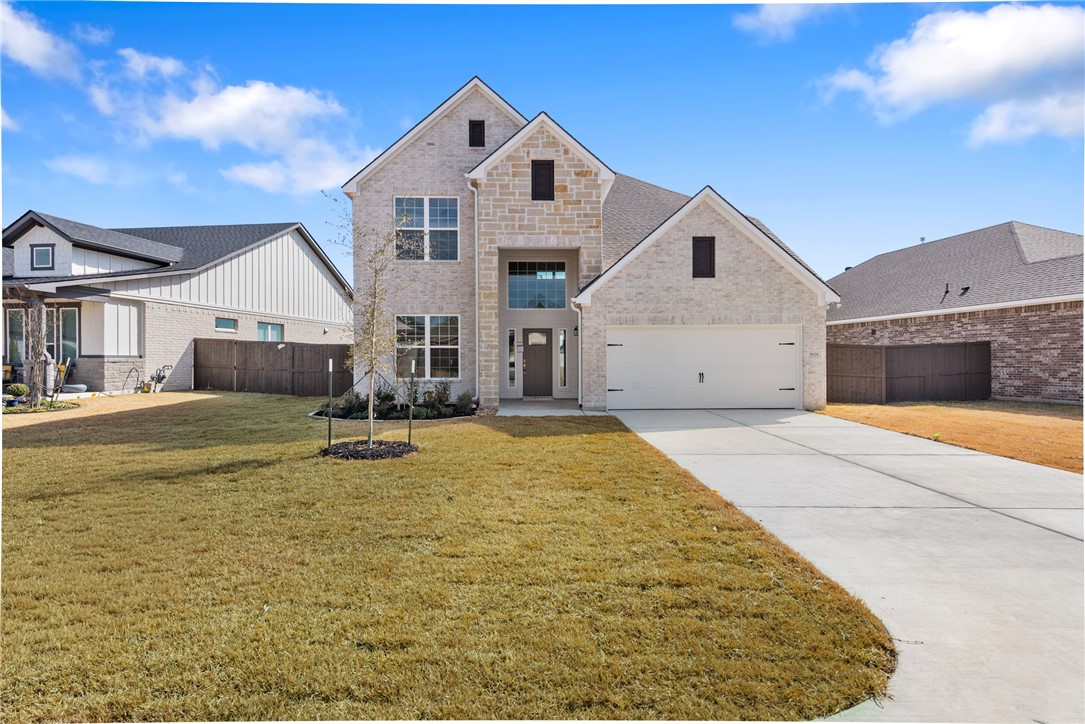 5626 Hayduke Ln. Bryan, TX 77802 - Photo 1 of 49 a front view of a house with a yard