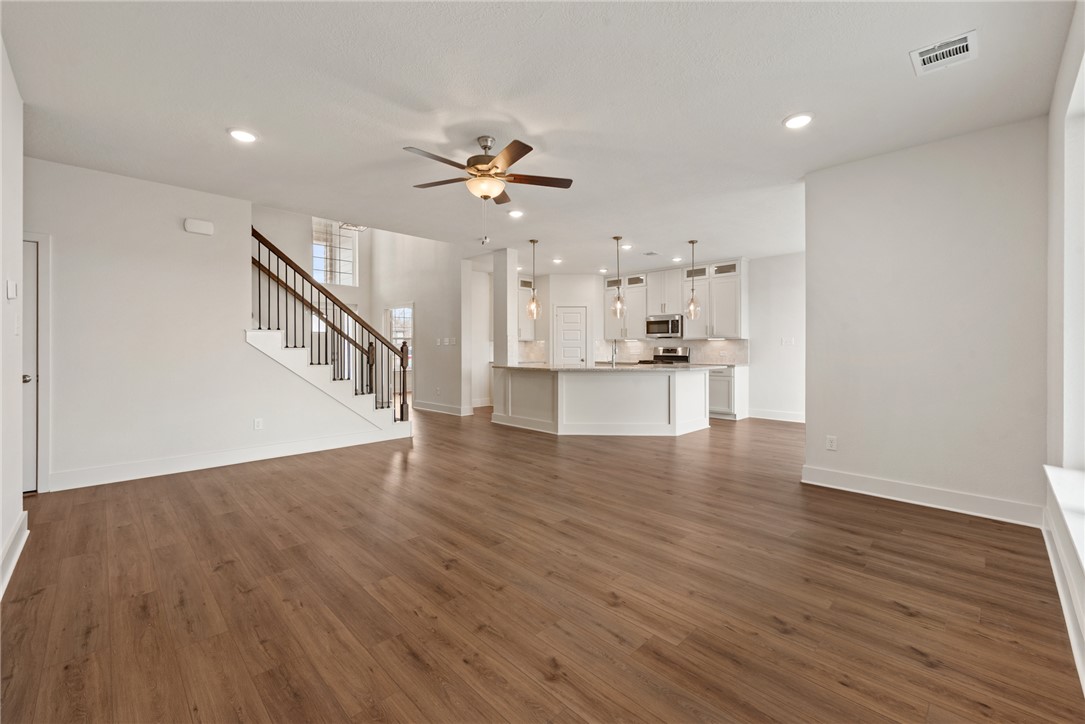 5626 Hayduke Ln. Bryan, TX 77802 - Photo 18 of 49 a view of a kitchen with wooden floor and a kitchen