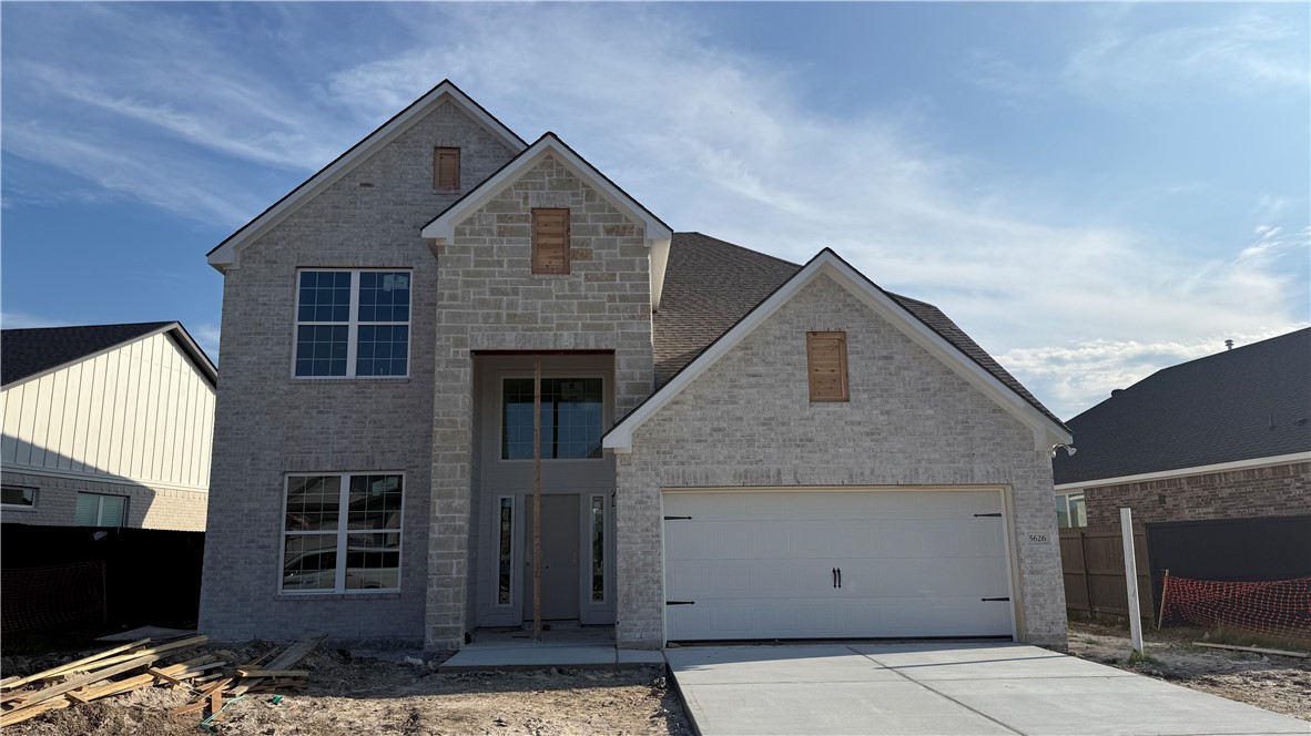5626 Hayduke Ln. Bryan, TX 77802 - Photo 2 of 10 a front view of a house with a garage