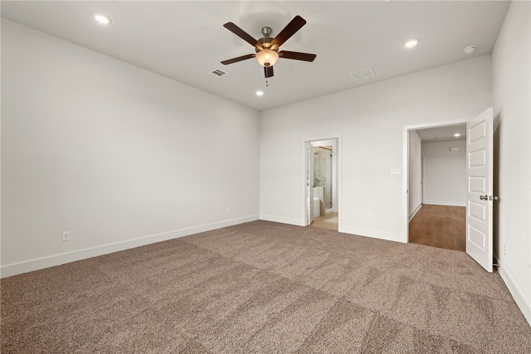 5626 Hayduke Ln. Bryan, TX 77802 - Photo 21 of 49 an empty room with cabinet and a ceiling fan
