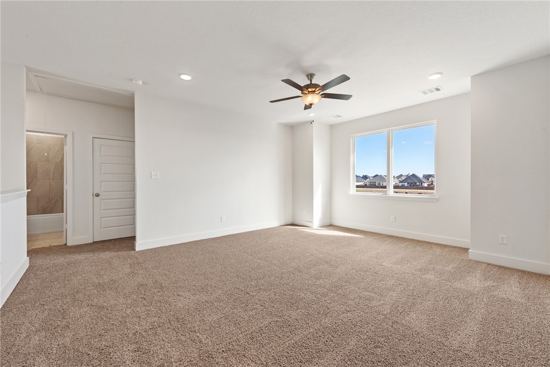 5626 Hayduke Ln. Bryan, TX 77802 - Photo 31 of 49 a view of an empty room with a kitchen