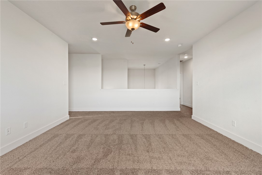 5626 Hayduke Ln. Bryan, TX 77802 - Photo 33 of 49 an empty room with fan and a ceiling fan