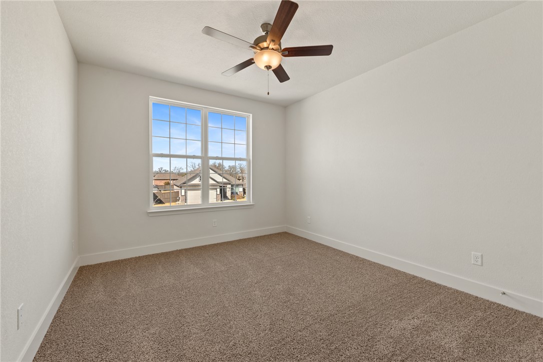 5626 Hayduke Ln. Bryan, TX 77802 - Photo 38 of 49 an empty room with windows and fan