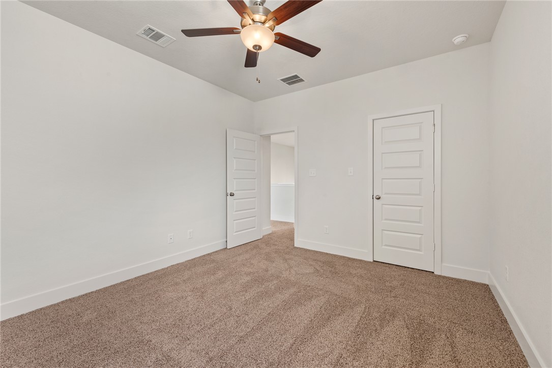 5626 Hayduke Ln. Bryan, TX 77802 - Photo 42 of 49 an empty room with closet and fan