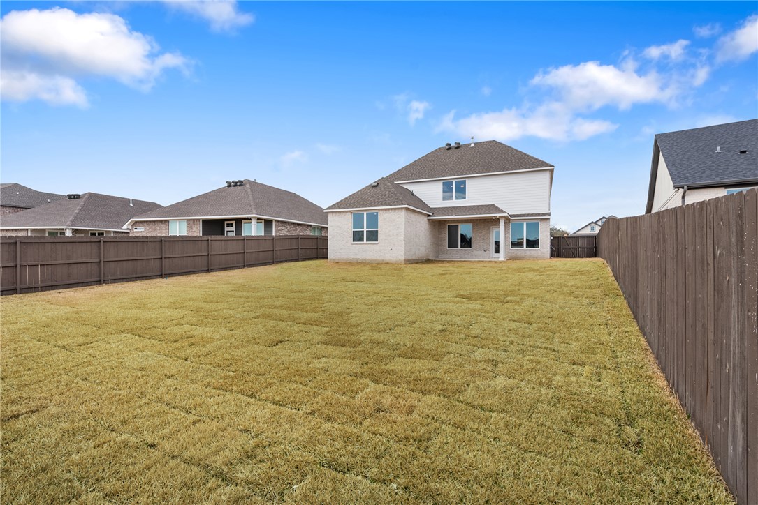 5626 Hayduke Ln. Bryan, TX 77802 - Photo 47 of 49 a front view of a house with a yard
