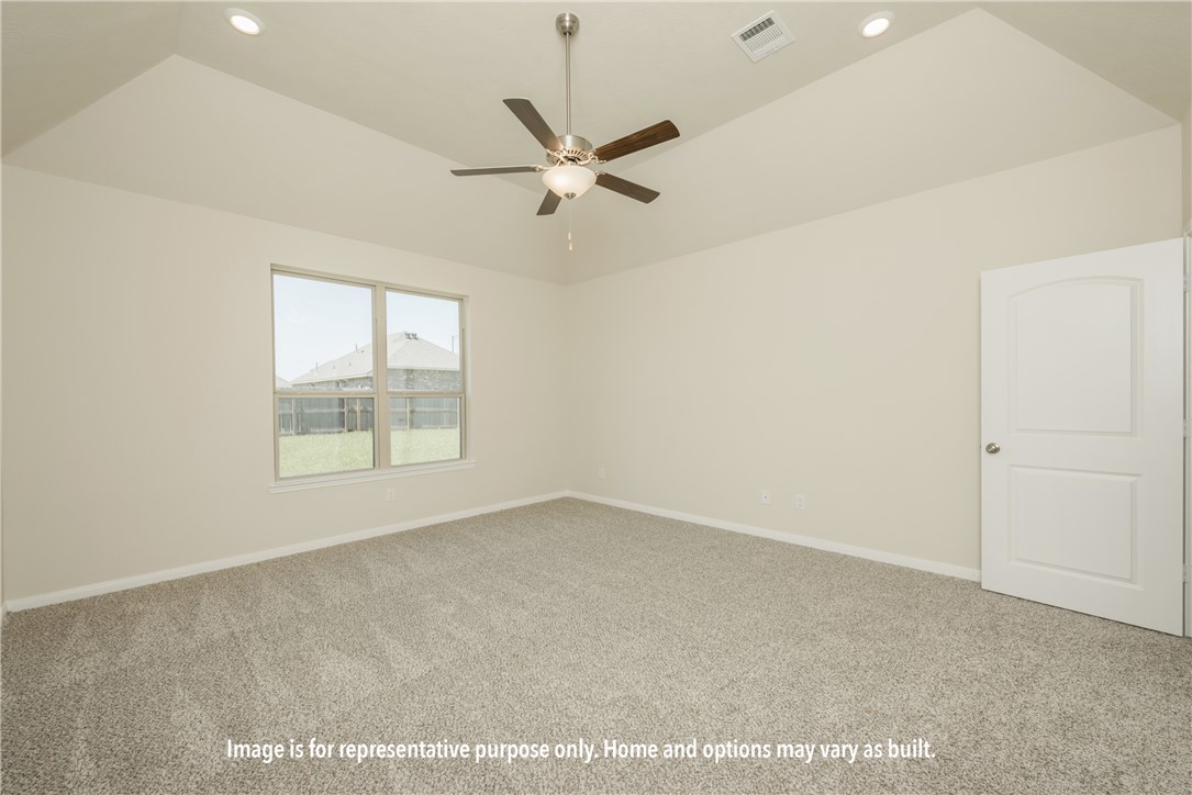 5626 Hayduke Ln. Bryan, TX 77802 - Photo 8 of 10 an empty room with windows and fan