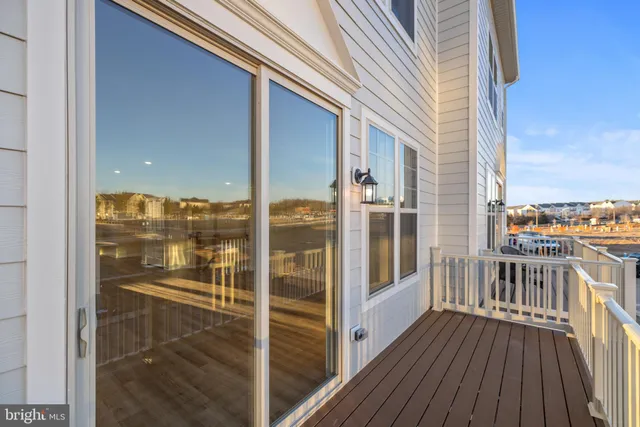 a view of a balcony with floor to ceiling window wooden floor and outdoor space