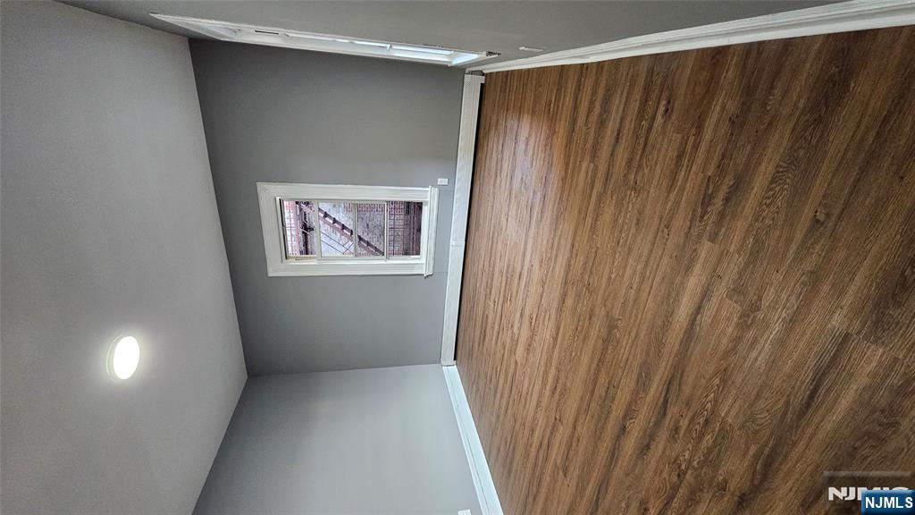 78 North Arlington Avenue, Unit 2 East Orange, NJ 07017 - Photo 2 of 9 a view of a room with an empty space and wooden floor