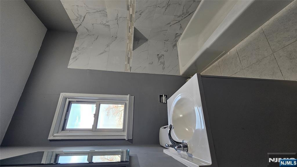 78 North Arlington Avenue, Unit 2 East Orange, NJ 07017 - Photo 9 of 9 a bathroom with a bathtub and a sink