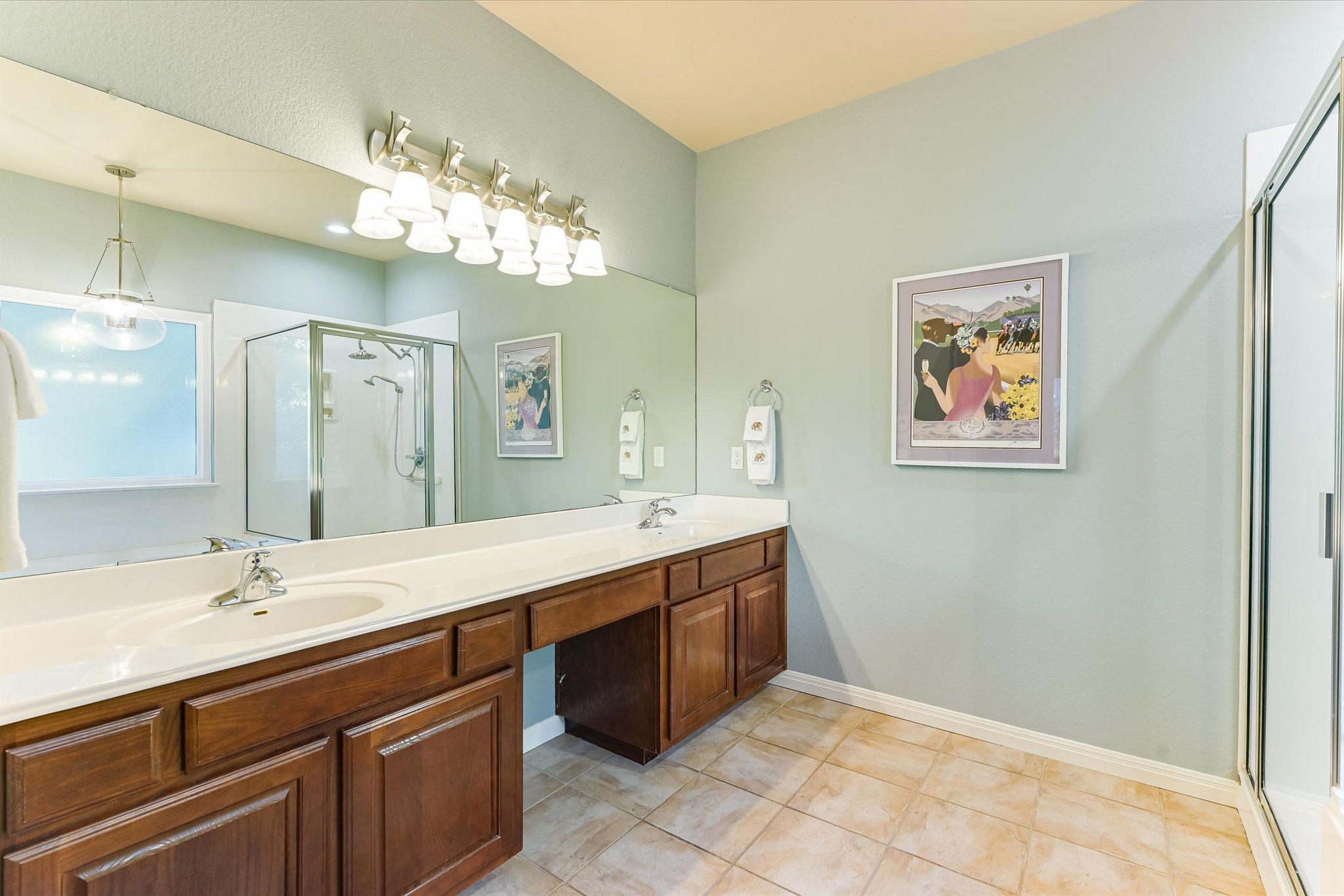 786 Ranchers Club Lane Driftwood, TX 78619 - Photo 18 of 33 Bathroom with a stall shower, double vanity, and light tile patterned floors