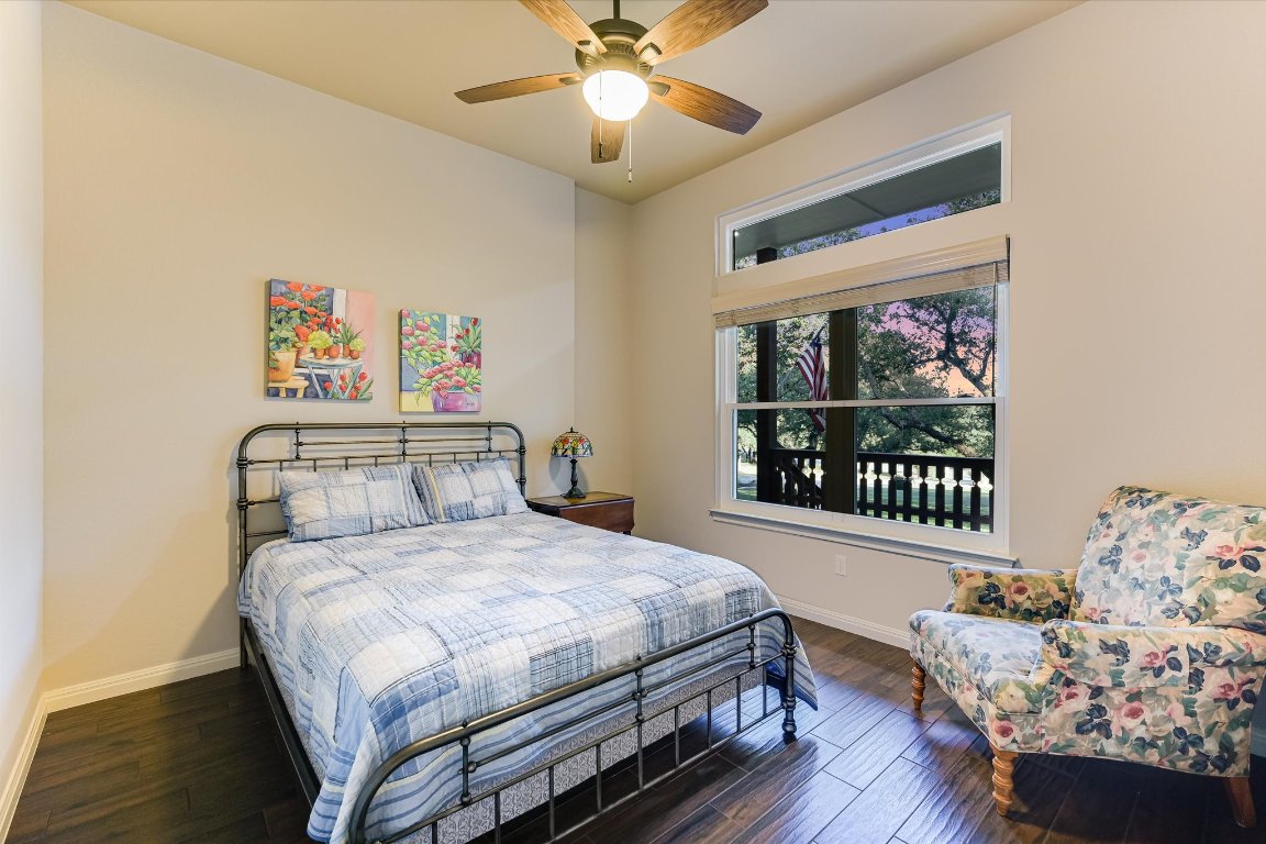 786 Ranchers Club Lane Driftwood, TX 78619 - Photo 22 of 33 a bedroom with a bed and a window