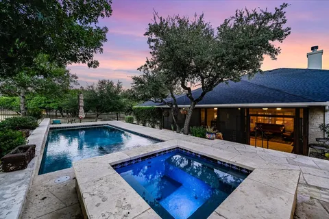 swimming pool view with a seating space