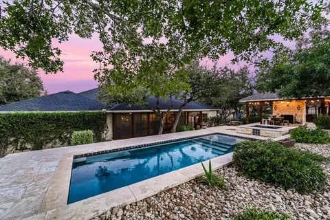 a view of swimming pool with sitting area