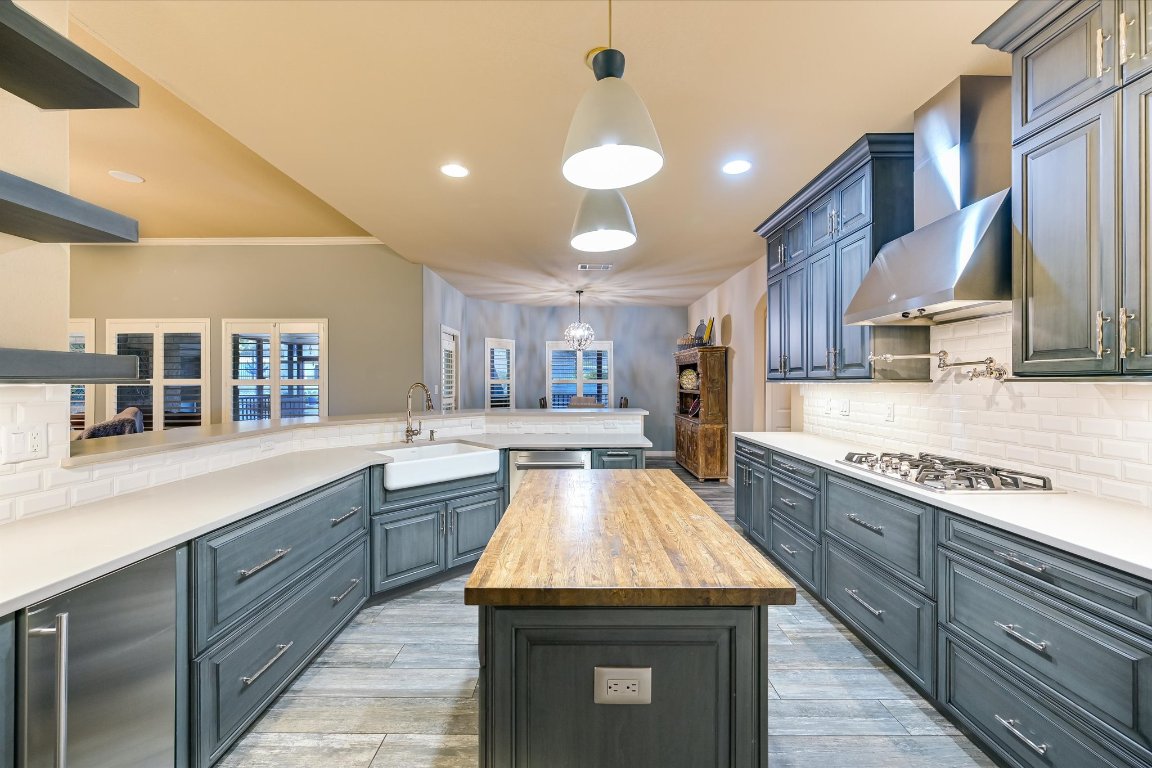 786 Ranchers Club Lane Driftwood, TX 78619 - Photo 5 of 33 a kitchen with lots of counter space and a sink
