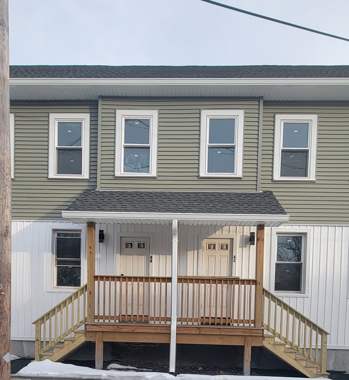 42 Front Street, Unit 42 Chicopee, MA 01013 - Photo 1 of 1 a view of a house with deck and wooden floor