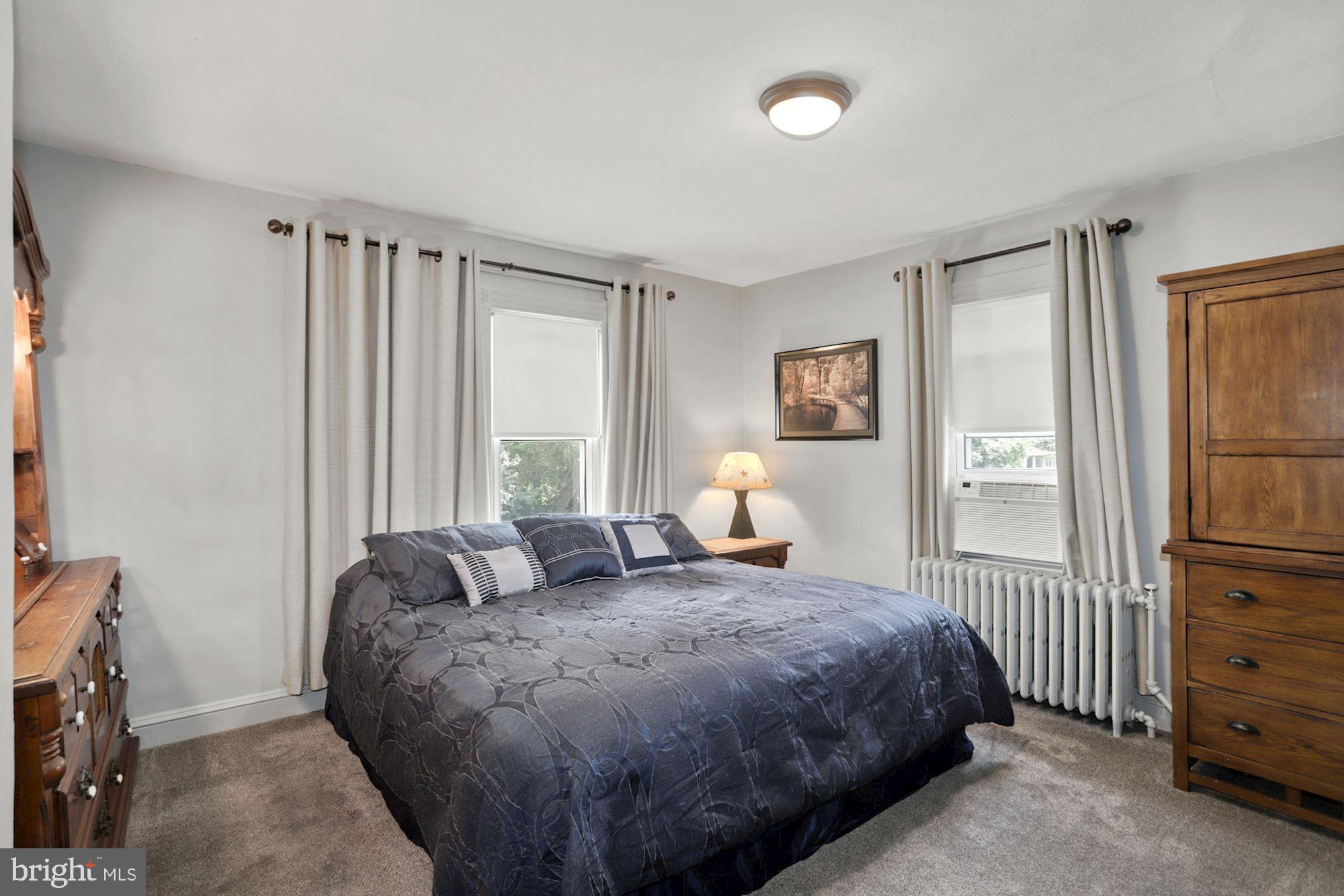 8029 Philadelphia Road Baltimore, MD 21237 - Photo 14 of 29 a bedroom with a bed and a window