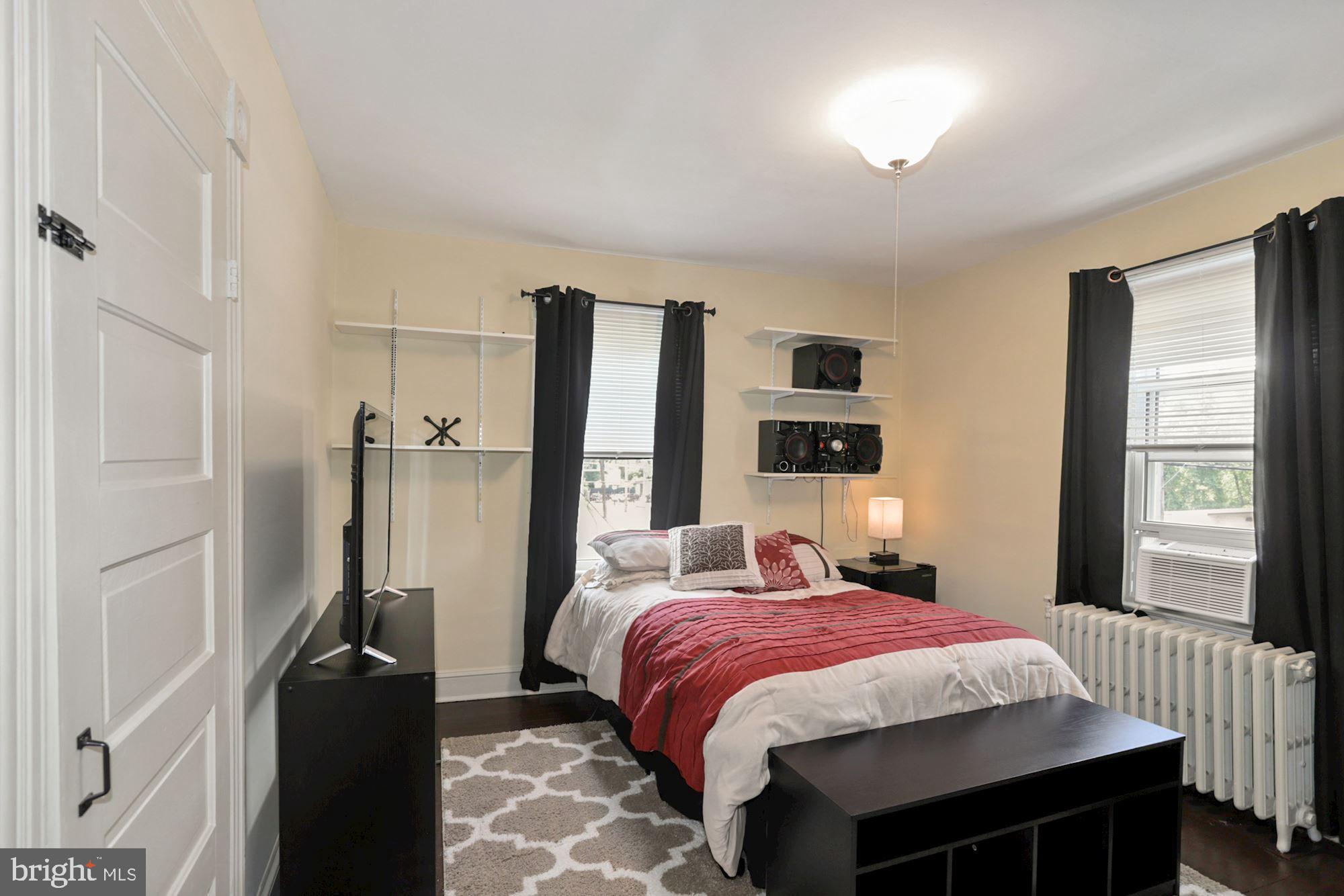 8029 Philadelphia Road Baltimore, MD 21237 - Photo 17 of 29 a bedroom with a bed and a window