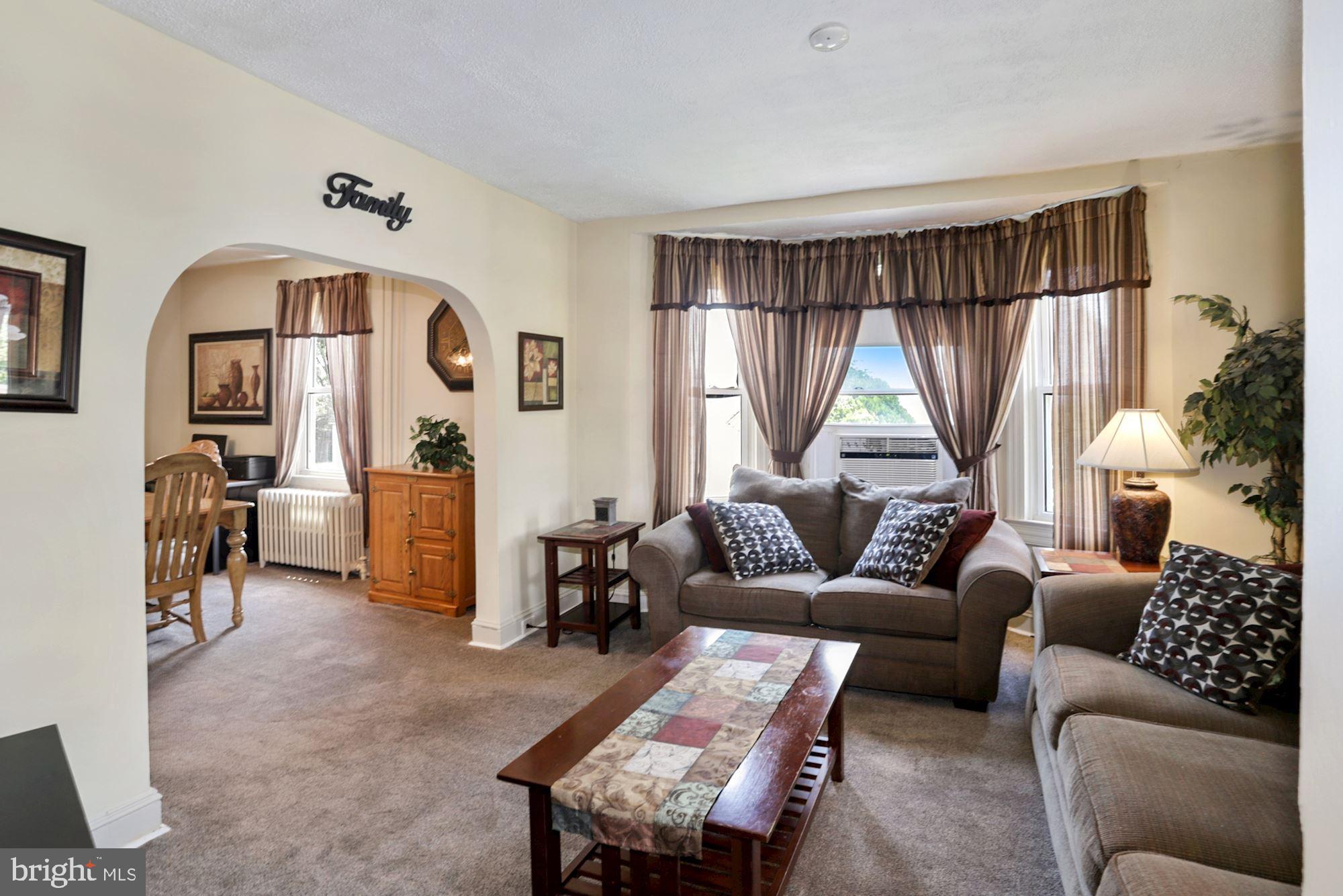 8029 Philadelphia Road Baltimore, MD 21237 - Photo 6 of 29 a living room with furniture and a large window