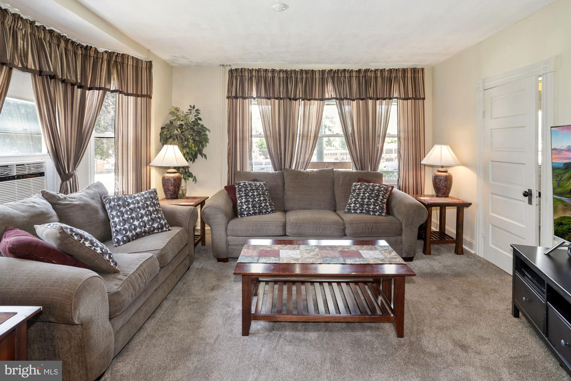 8029 Philadelphia Road Baltimore, MD 21237 - Photo 7 of 29 a living room with furniture and a large window