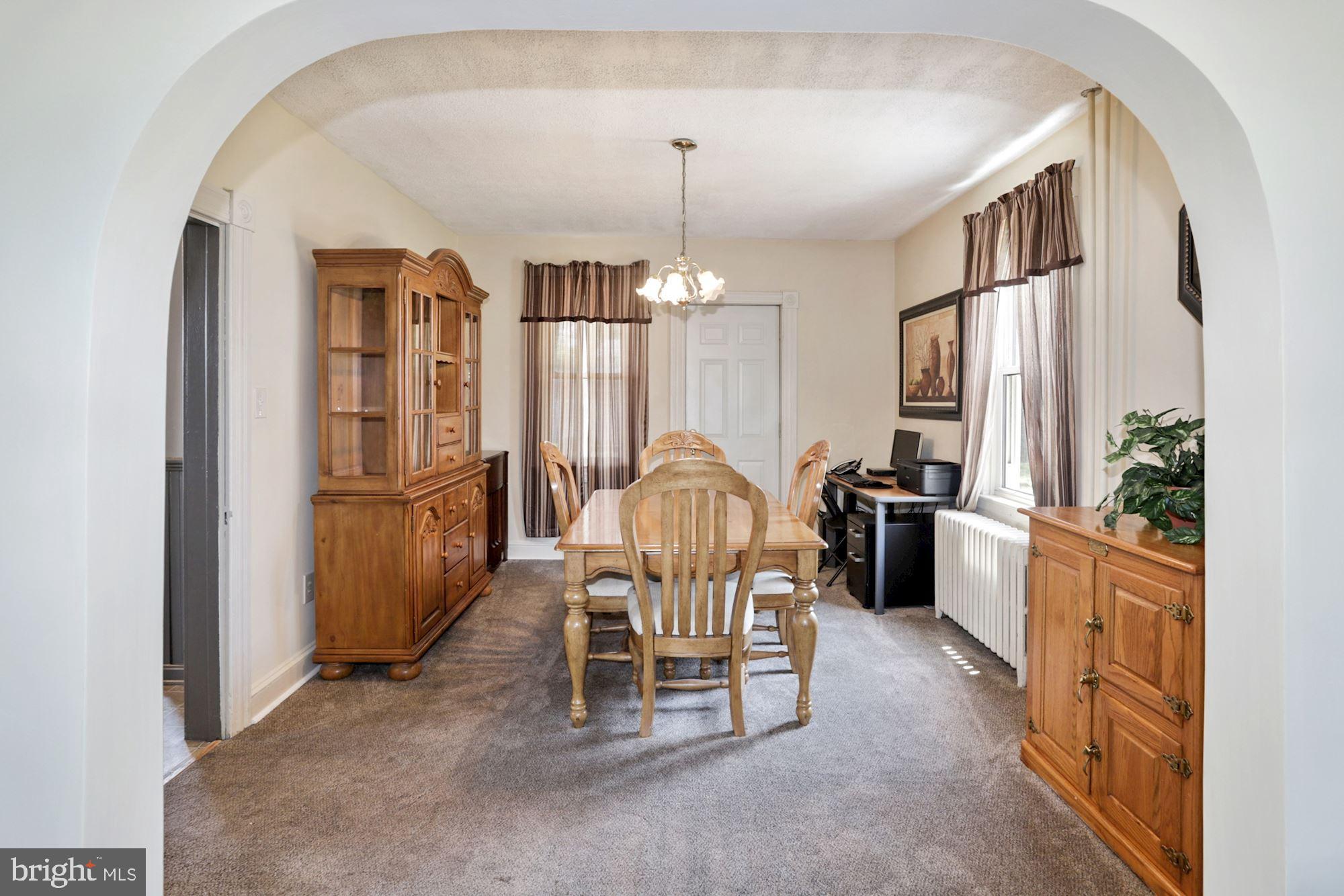 8029 Philadelphia Road Baltimore, MD 21237 - Photo 8 of 29 a view of a dining room with furniture window and wooden floor